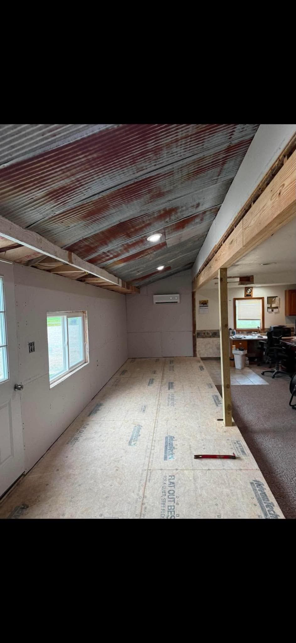 Room addition with vaulted ceiling and new subfloor by AMC Construction